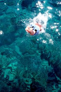 Young woman swimming underwater