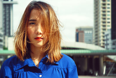 Portrait of beautiful woman with tousled hair