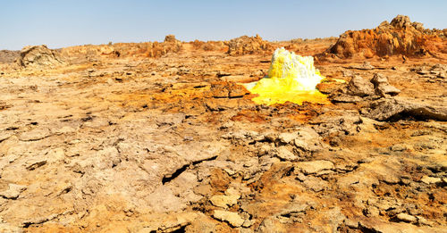 Rock formation on land against sky