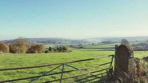 Countryside landscape against clear sky