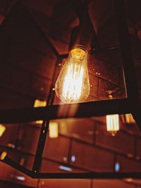 Low angle view of illuminated light bulb