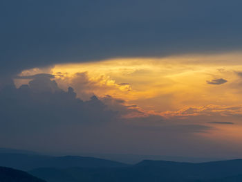 Low angle view of dramatic sky during sunset