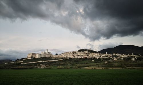 Built structure on landscape against sky