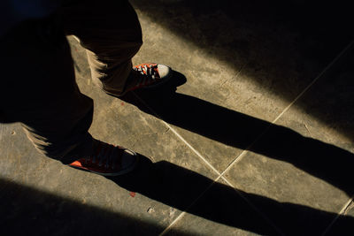 Low section view of man on street