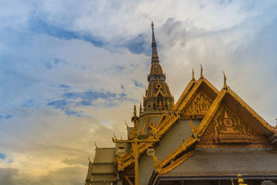 Low angle view of temple building against cloudy sky