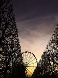 Silhouette ferris wheel against sky at sunset