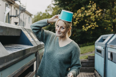 Woman recycling rubbish