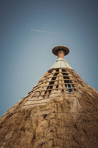 Low angle view of tower against clear blue sky