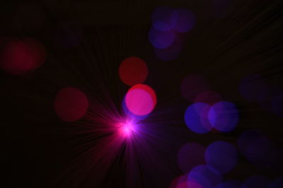Defocused image of illuminated lights at night