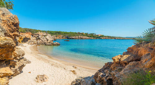 Scenic view of bay against clear sky