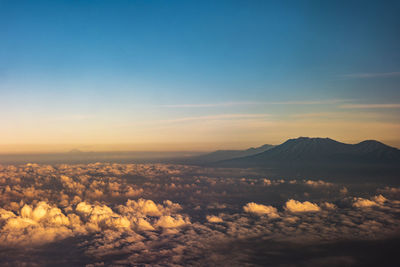 Aerial view of landscape against sky during sunset