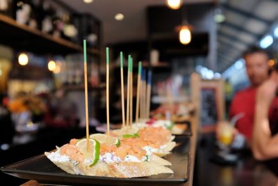 Foods in plates on bar counter