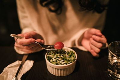 Midsection of woman preparing food