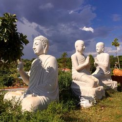 Statue of buddha against sky