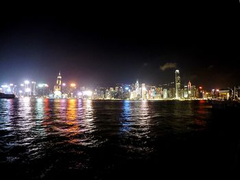 Illuminated city at waterfront