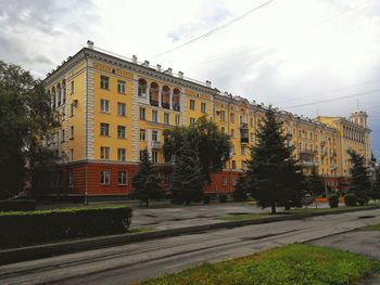 View of buildings against cloudy sky