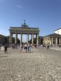 Group of people in front of historical building