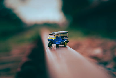 Close-up of hand toy car