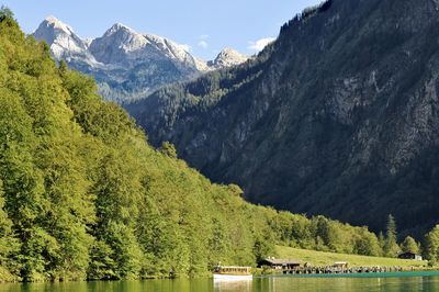 Scenic view of lake and mountains against sky