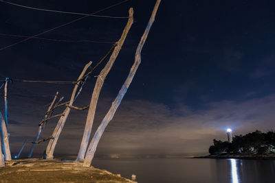 Scenic view of sea against sky at night