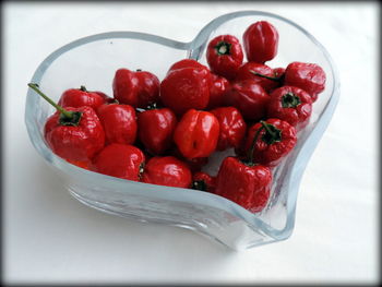 High angle view of strawberries in bowl on table