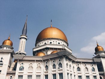 Low angle view of mosque against clear sky