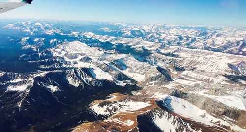 Aerial view of snow covered mountains