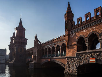 Low angle view of historical oberbaumbrücke bridge against sky, berlin