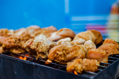Close-up of meat on barbecue grill