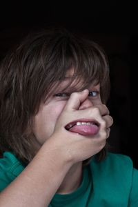 Digital composite image of mouth on boy hand