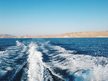 Scenic view of sea against clear blue sky