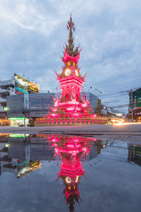 Reflection of illuminated building in water