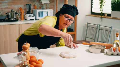 Friends preparing food at home