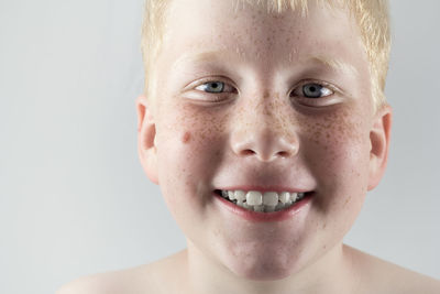 Close-up portrait of smiling boy