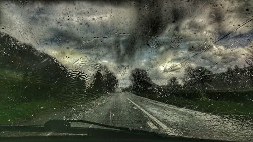 Road seen through car windshield