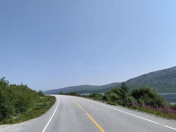 Empty road against sky