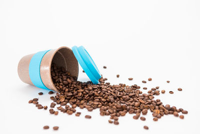 Close-up of coffee beans against white background