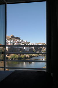View of cityscape seen through window