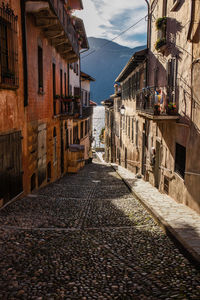 Narrow street amidst buildings in town