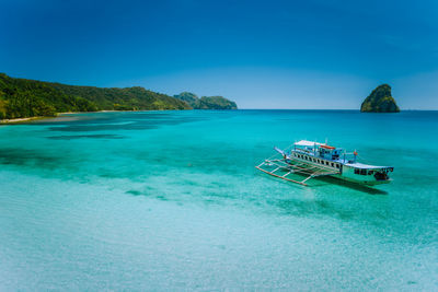 Scenic view of sea against blue sky