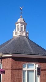 Exterior of church against clear blue sky