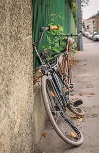 Bicycle parked against wall