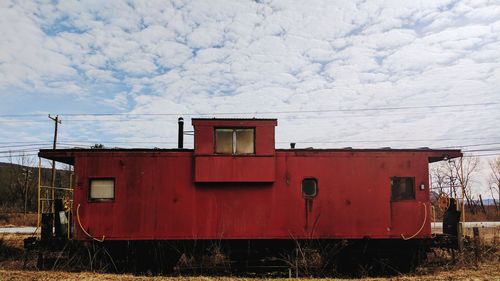 Red car against sky