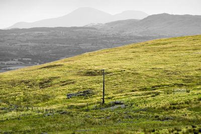 Scenic view of green landscape and mountains