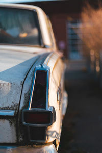 Close-up of vintage car on road