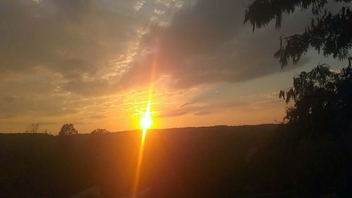 Scenic view of silhouette landscape against sky during sunset