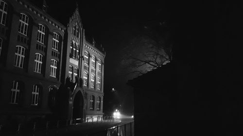 Low angle view of illuminated building at night