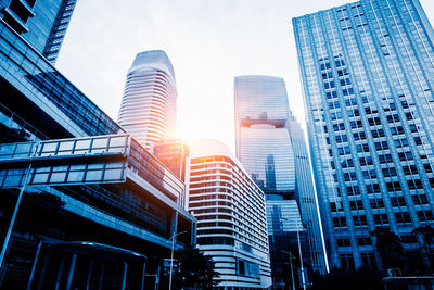 Low angle view of modern buildings against sky