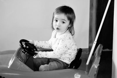 Portrait of cute girl sitting