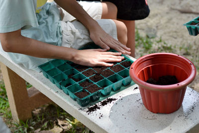 High angle view of kid planting in back yard